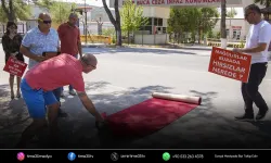 İzmir’de kooperatif mağdurlarından kırmızı halılı protesto